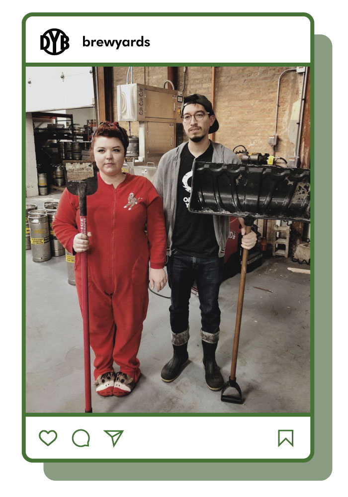 Two brewery workers recreate American Gothic painting holding a hoe and a shovel. Image inside Instagram feed frame. 