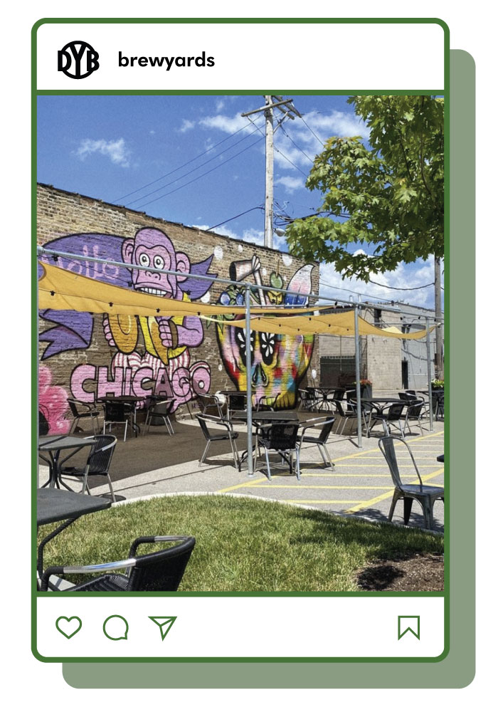 District Brew Yards outdoor patio with shade and tables inside Instagram feed frame. 